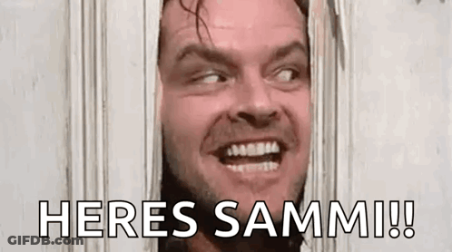 A Man Is Looking Through A Hole In A Door With The Words `` Heres Sammi ! '' GIF