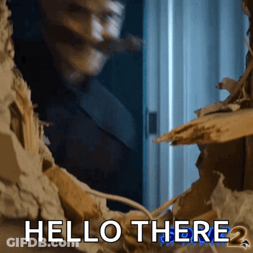 A Man Is Looking Through A Hole In A Wall With The Words Hello There 2 Below Him GIF