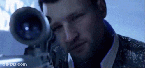 A Man Is Looking Through A Sniper Rifle With A Blue Background GIF