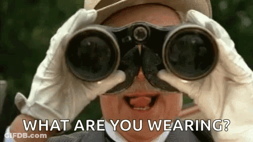 A Man Is Looking Through Binoculars With The Words `` What Are You Wearing ? '' Behind Him . GIF