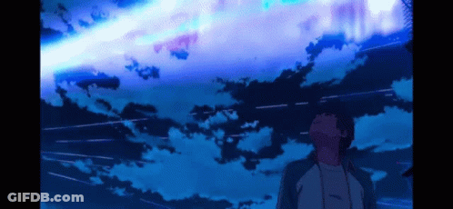 A Man Is Looking Up At A Blue Sky With A Shooting Star GIF
