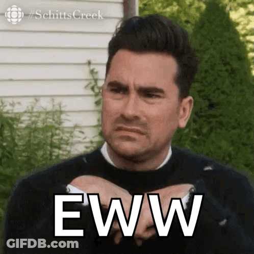 A Man Is Making A Funny Face And Holding His Hands Together With The Word Eww Written On His Chest . GIF