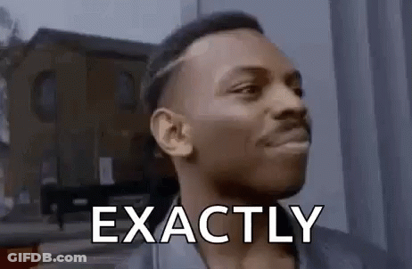 A Man Is Making A Funny Face And Saying `` Exactly '' In Front Of A Building . GIF