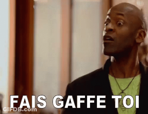 A Man Is Making A Funny Face And Saying `` Fais Gaffe Toi '' In French . GIF