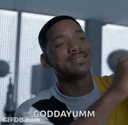 A Man Is Making A Funny Face And Saying `` Goddayumm '' While Standing In Front Of A Window . GIF