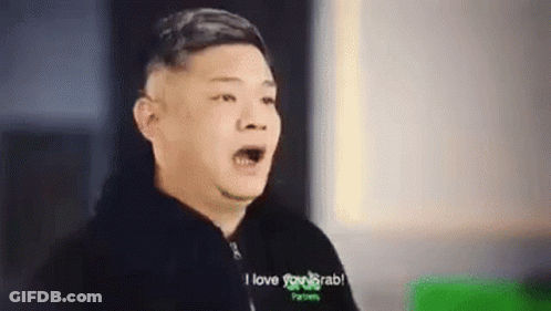 A Man Is Making A Funny Face And Saying `` I Love You Grab '' While Wearing A Black Jacket . GIF