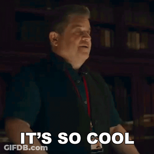 A Man Is Making A Funny Face And Saying `` It 'S So Cool '' With His Hands In The Air . GIF