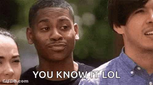 A Man Is Making A Funny Face And Saying `` You Know It Lol '' While Standing Next To Two Other Men . GIF
