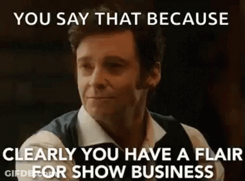 A Man Is Making A Funny Face And Saying `` You Say That Because Clearly You Have A Flair For Show Business '' GIF