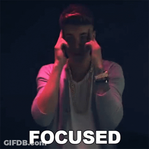 A Man Is Making A Funny Face And The Word Focused Is Above Him GIF