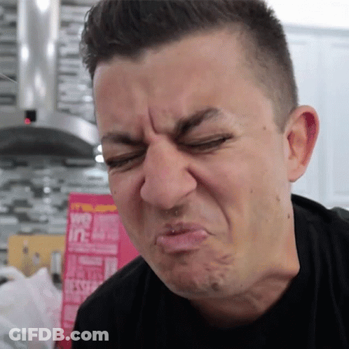 A Man Is Making A Funny Face In Front Of A Box That Says ' Oats ' On It GIF