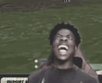 A Man Is Making A Funny Face In Front Of A Report Sign . GIF