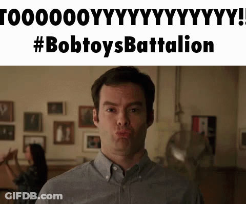 Man Making Funny Face In Front Of Bobtoys Battalion Sign GIF