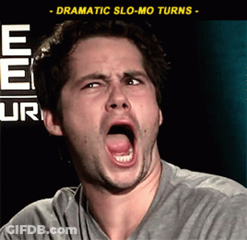 A Man Is Making A Funny Face In Front Of A Sign That Says Ee Ur GIF