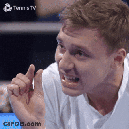 A Man Is Making A Funny Face In Front Of A Tennis TV Sign GIF