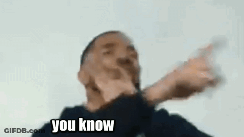 A Man Is Making A Funny Face While Holding A Glass Of Water . GIF