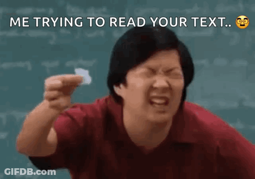 A Man Is Making A Funny Face While Holding A Piece Of Paper In Front Of A Chalkboard . GIF