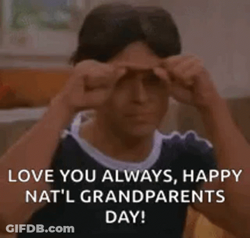 A Man Is Making A Funny Face While Holding His Hands To His Eyes . GIF