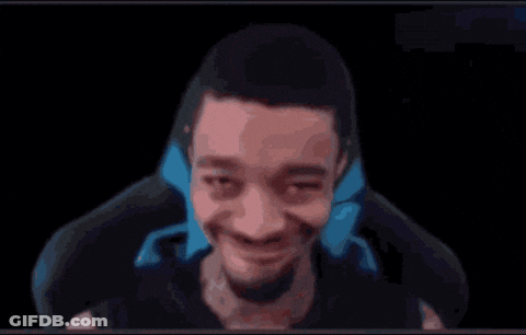 A Man Is Making A Funny Face While Sitting In A Chair In Front Of A Black Background . GIF