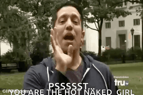 A Man Is Making A Funny Face While Standing In A Park And Says `` You Are The Hot Naked Girl '' . GIF
