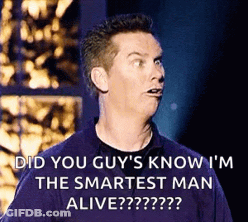 A Man Is Making A Funny Face While Standing On A Stage . GIF