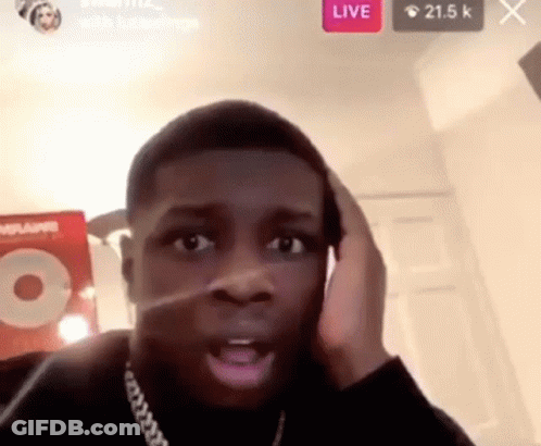 A Man Is Making A Funny Face While Talking On A Phone . GIF