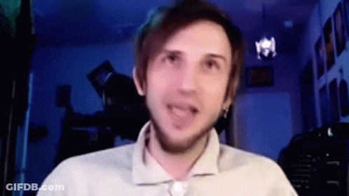 A Man Is Making A Funny Face While Talking On A Video Call . GIF