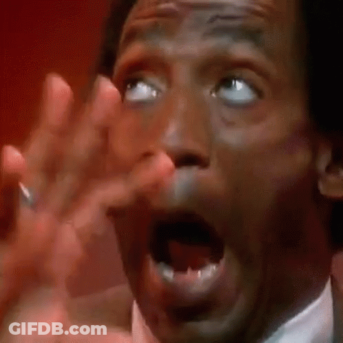 A Man Is Making A Funny Face With His Mouth Open . GIF