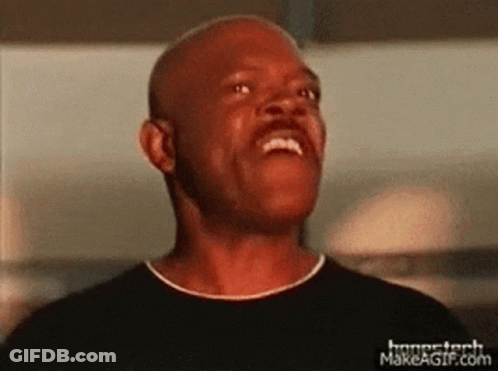 A Man Is Making A Funny Face With His Mouth Open . GIF