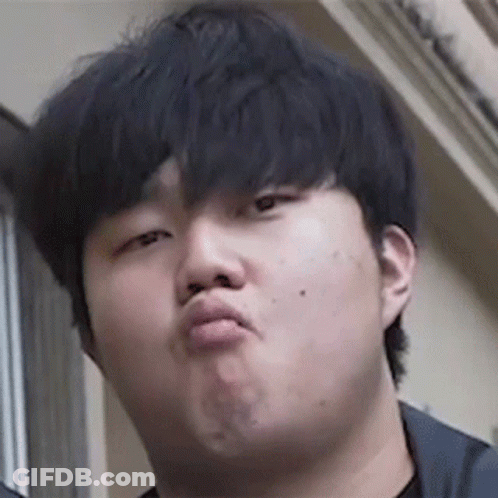 A Man Is Making A Funny Face With His Mouth Open . GIF