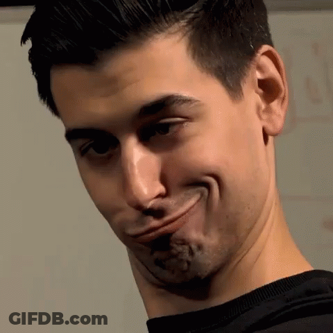 A Man Is Making A Funny Face With His Mouth Wide Open GIF