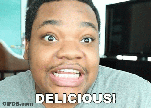 A Man Is Making A Funny Face With The Word Delicious Written On His Face GIF