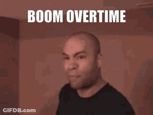 A Man Is Making A Funny Face With The Words Boom Overtime Behind Him GIF