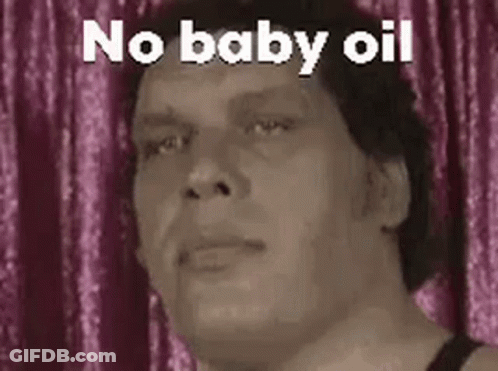 A Man Is Making A Funny Face With The Words `` No Baby Oil '' . GIF