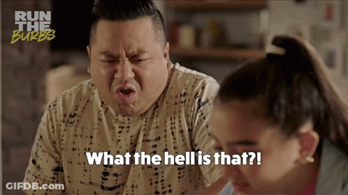 A Man Is Making A Funny Face With The Words What The Hell Is That Written Below Him GIF