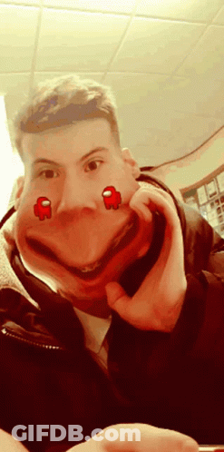 A Man Is Making A Funny Face With Two Red Among Us Characters On His Face GIF