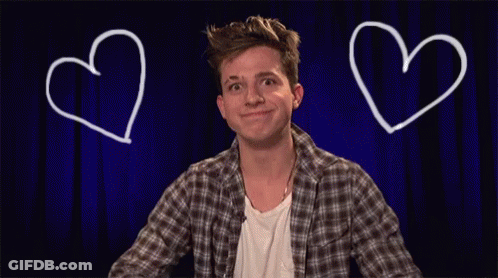 A Man Is Making A Heart Shape With His Hands GIF