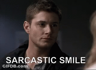 A Man Is Making A Sarcastic Smile While Looking At Another Man . GIF