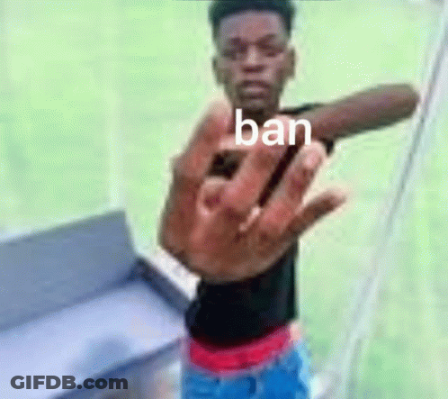 A Man Is Making A Stop Sign With His Hand While Standing In Front Of A Tent . GIF