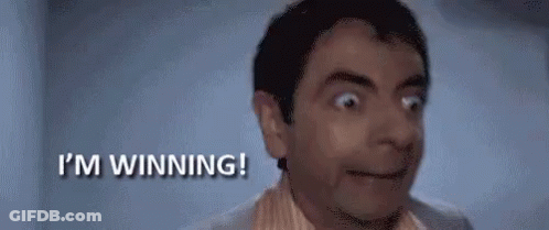 A Man Is Making A Surprised Face And Saying `` I 'M Winning ! '' GIF