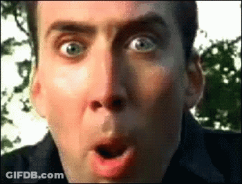 A Man Is Making A Surprised Face With His Mouth Open GIF