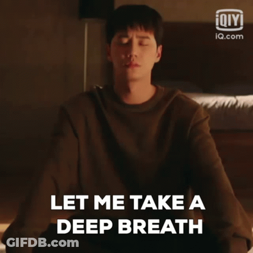 A Man Is Meditating With His Eyes Closed And Saying Let Me Take A Deep Breath GIF