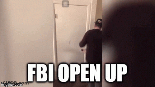 A Man Is Opening A Door With The Words Fbi Open Up Written On It GIF