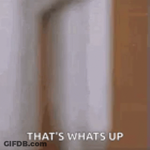 A Man Is Peeking Out From Behind A Door And Says `` That 'S Whats Up '' . GIF