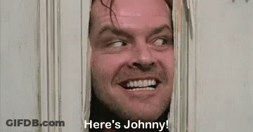 A Man Is Peeking Through A Door And Saying `` Here 'S Johnny ! '' GIF