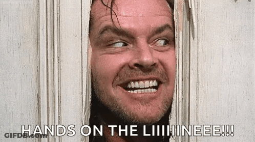 A Man Is Peeking Through A Hole In A Door And Smiling . GIF