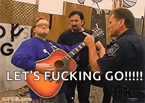 A Man Is Playing A Guitar In Front Of A Police Officer While Another Man Looks On . GIF