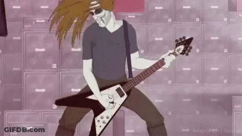 A Man Is Playing A Guitar In Front Of A Wall Of Speakers . GIF
