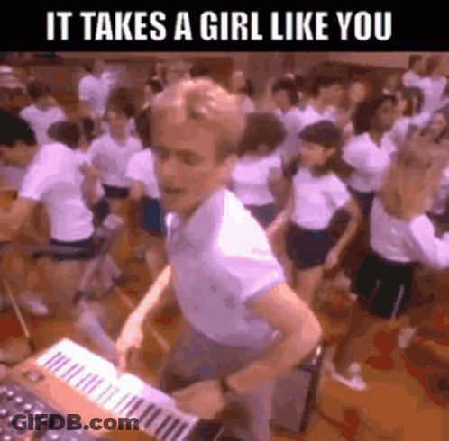 A Man Is Playing A Keyboard In Front Of A Crowd Of People With The Caption It Takes A Girl Like You GIF