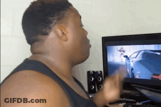 A Man Is Playing A Video Game On A Computer . GIF